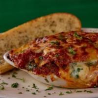 Italian Flag Lasagna · Pasta stuffed with our meat sauce, a little bit of spinach, Italian cheeses and topped with ...