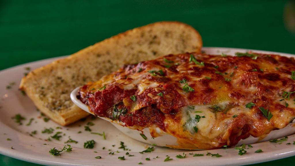 Italian Flag Lasagna · Pasta stuffed with our meat sauce, a little bit of spinach, Italian cheeses and topped with marinara, then baked to perfection. Made daily, so served until there ain't know more!