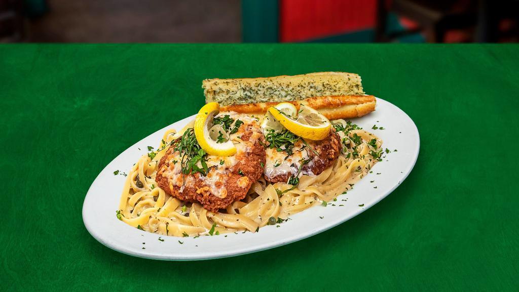 Hakuna Piccatta · Two large chicken breasts lightly breaded and baked to perfection, served over fettuccini pasta with a delicious lemon butter sauce and those cool little capers. Try this and have no worries for the rest of your night.