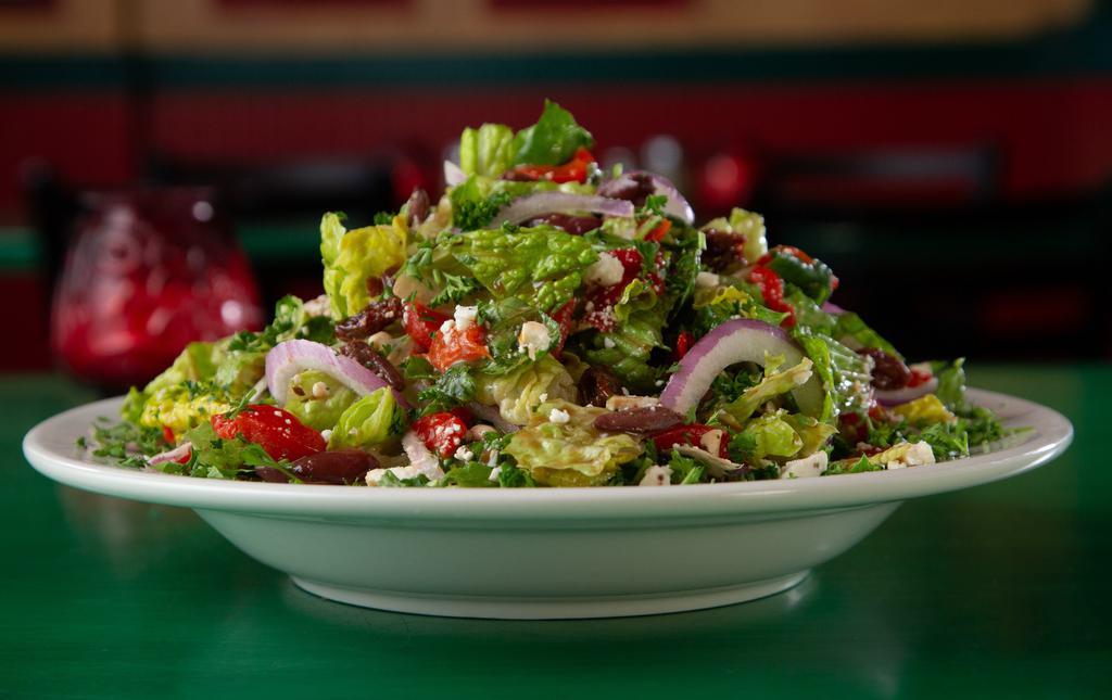 Oregano’S Favorite · And soon to be yours! Fresh Romaine blend, roasted red peppers, our spiced feta cheese, combined with a medley of sun dried tomatoes, Kalamata olives, pine nuts and raisins, with our tasty honey vinaigrette dressing and topped with red onions.
