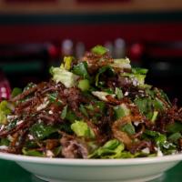 The Big Beefstro Salad · We start with a LARGE amount of our tasty shaved ribeye, add jalapenos, cotija cheese, tomat...