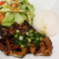 Pork Chop Rice Dish · Grilled pork chops served with a side of fresh salad. Can add fried egg to any dish for an a...