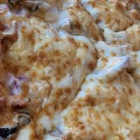 Chicken Pesto Pizza · Basil pesto sauce, chicken breast, red onions, mushrooms and goat cheese.