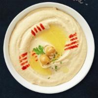 Hammered Hummus Pita · Cooked and mashed chickpeas blended with tahini, lemon juice, and garlic served with pita br...