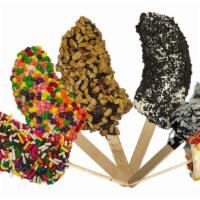 Frozen Banana Treats · Bite size pieces of banana, dipped in chocolate, coated with our most popular toppings. Serv...