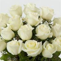 One Dozen White Medium Stem Roses  · One Dozen florist quality medium stem roses will be arranged as a bouquet  in clear  glass v...