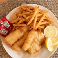 Cod Fish · Beer-battered fillet of cod, served over crispy French fries.