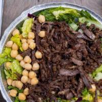 Steak Shawarma Bowl · Steak shawarma served over a bowl of rice, with Mediterranean salad, your choice of veggies ...