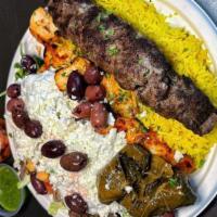 Steak Shawarma Plate · Steak shawarma served over a plate of rice with Mediterranean salad, your choice of veggies ...