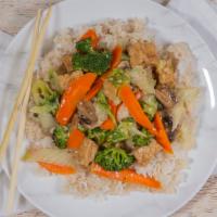 Cơm Rau Đậu Hũ Xào · Wok tossed vegetables and fried tofu in light ginger sauce served with jasmine rice.