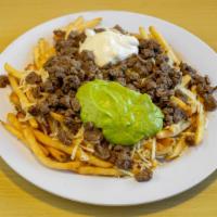 Carne Asada Fries Burrito · With steak, fries, guacamole, sour cream and Monterey cheese.