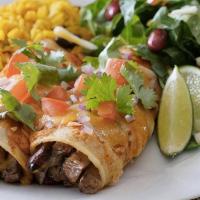 Steak Enchiladas · Steak, enchilada sauce, cheese, and lettuce.