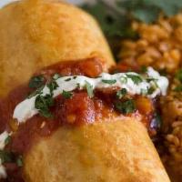 Chicken Chimi · Chicken filled with beans and cheese with pico de gallo, lettuce, guacamole and sour cream.