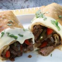 Carne Asada Chimi · Steak filled with beans and cheese with  guacamole and sour cream.