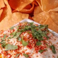 Elote Salsa & Chips · Fire roasted sweet corn tossed with pico de gallo, cilantro lime crema, queso fresco, and ta...