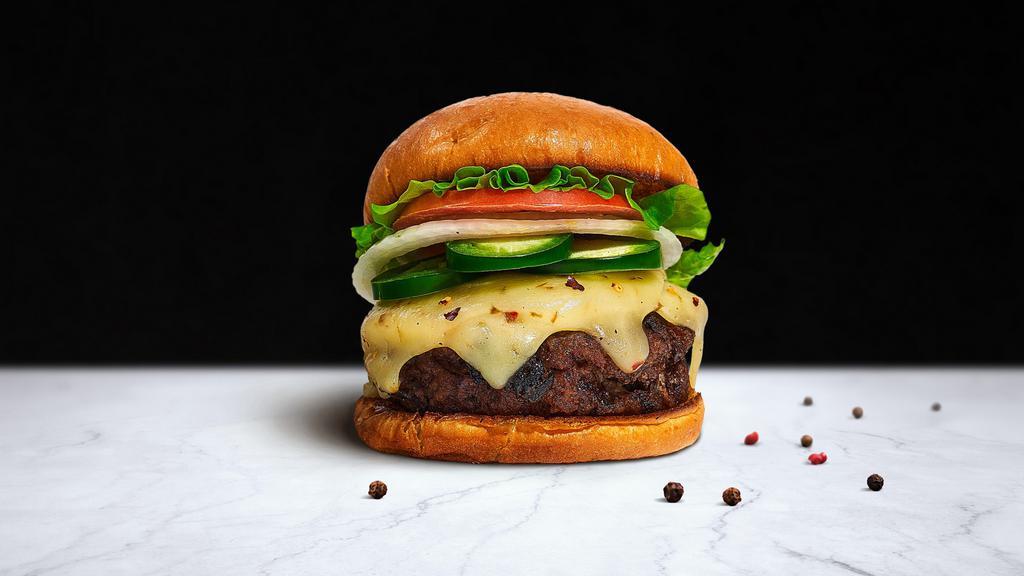 Jalapeno Mission Impossible Burger · Plant-based impossible patty grilled and topped with melted vegan mozzarella cheese, jalapenos, buttered lettuce, tomato, onion, and pickles