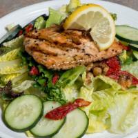 Seared Salmon Salad · Pepper-crusted salmon, sun-dried tomato, cucumber, glazed walnuts, and parmesan served on a ...