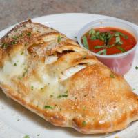 Calzone · Ricotta, mozzarella and any two toppings. Served with marinara sauce.