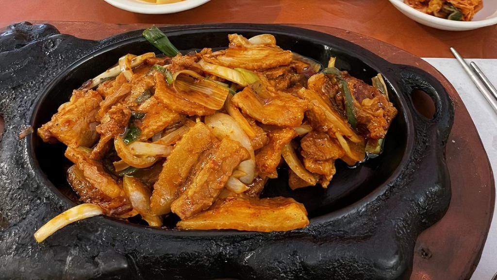 Pork Bulgogi · Flame-broiled pork marinated in spicy korean sauces. Served with white rice.