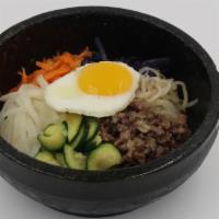Bibimbap · USDA-Choice beef bulgogi, assorted fresh vegetables, and a fried egg over steamed rice. Serv...