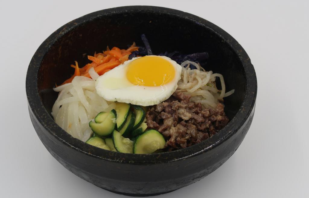 Bibimbap · USDA-Choice beef bulgogi, assorted fresh vegetables, and a fried egg over steamed rice. Served with hot sauce on the side.