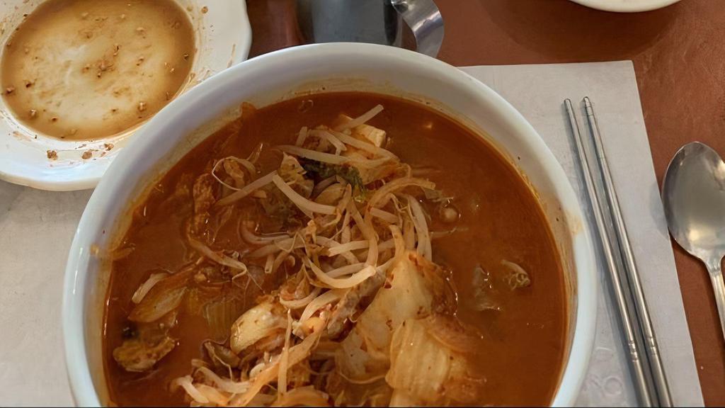 Kimchi Soup · Soup made with kimchi, pork, and tofu. Served with rice.
