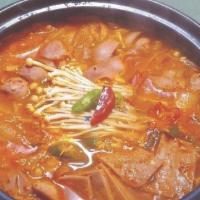 Budae Jike · Troop hot pot. Rice cake, kimchi, cheese, all beef hotdog, and spam made with fresh vegetabl...