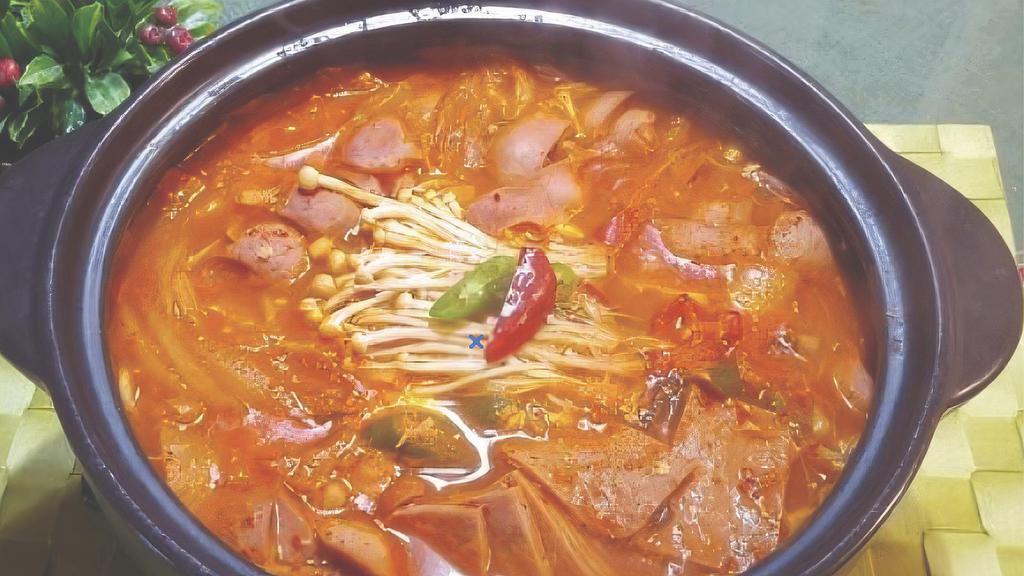 Budae Jike · Troop hot pot. Rice cake, kimchi, cheese, all beef hotdog, and spam made with fresh vegetables and ramen noodles. Served with two rices