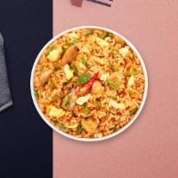 Flaming Hot Fried Rice · Brown rice stir-fried in curry powder with pineapple, bell pepper, onion, carrot, and cashews.