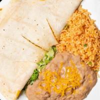 Stuffed Quesadilla · Meat w/ green chile strips, sour cream & guac, and rice & beans