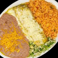 Tamale Plate · Green corn tamale smothered in green enchilada sauce & cheese, rice & beans