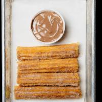 Churros · 4 cream filled churros served with chocolate dip