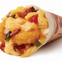 Scrambler Breakfast Burrito · A warm Flour Tortilla, fluffy Scrambled Eggs, zesty Nacho Cheese, Potato Olés®, Poblano Pepp...