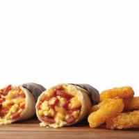 Two Junior Breakfast Burritos Combo · Each burrito is made with a warm Flour Tortilla filled with delicious Scrambled Eggs, Nacho ...