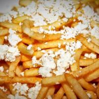 Greek Fries · French fries topped with crumbled fete cheese and oregano.