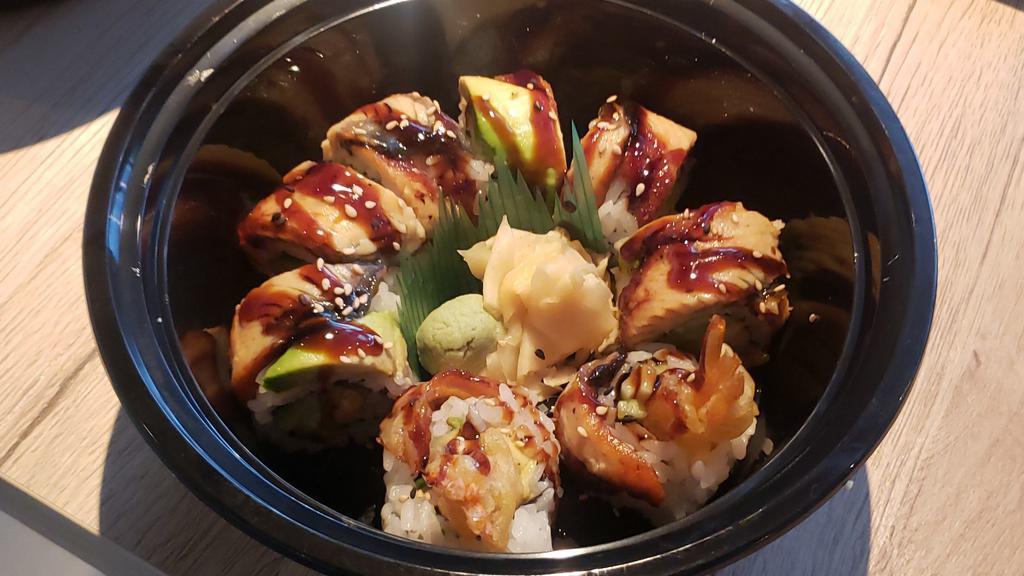 Dragon · (Inside) shrimp tempura roll (top) unagi, avocado (sauce) unagi.