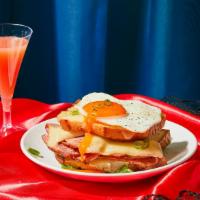 Croque Madame · Savory ham and rich gruyere cheese sandwiched between two slices of toasted white bread.