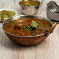 Goat Curry · Mild spicy.  Bone-in goat meat cubes marinated in South Indian masala and cooked in flavorfu...