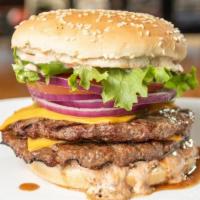 Double Classic Burger · Two 1/3 lb. Ground Chuck Patty Mesquite-Fired on a Toasted Bun, w/ In-House Made 1000 Island...