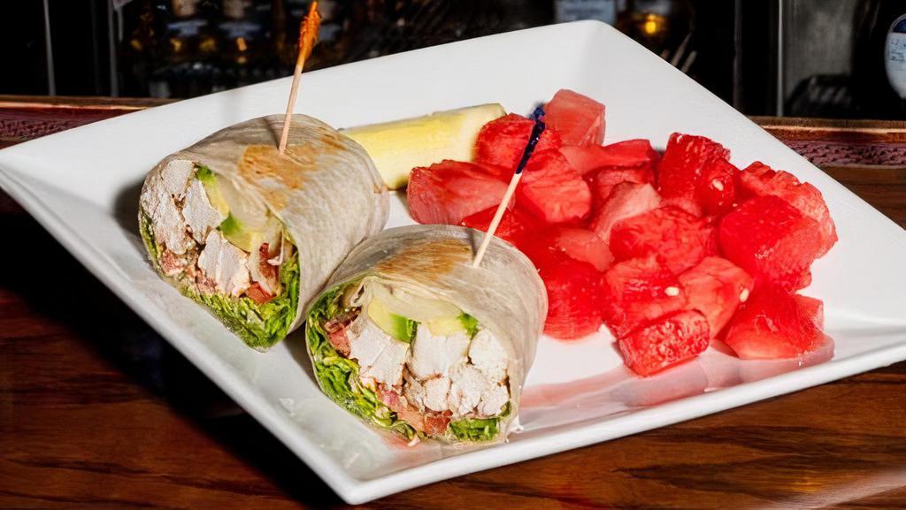 Chicken Bacon Avocado Wrap · Your choice of grilled or breaded chicken with romaine lettuce, tomato, bacon, fresh avocado, Swiss cheese, and chipotle mayo.