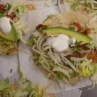 Fish Tacos · tilapia, lettuce, pico de gallo, avocado, sour cream, cheese.