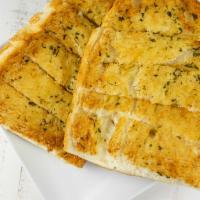 Garlic Bread · Half loaf of French bread covered with garlic butter. Comes with a side of pizza sauce. Cut ...