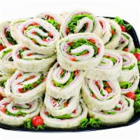 Pinwheel Snack Squares - Small · Soft Lavosh bread layered with Cream Cheese, Baked Ham, Premium Turkey Breast, Provolone, To...