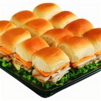 Turkey And Cheddar Sliders · Petite sandwiches made on sweet King's Hawaiian Rolls. Stuffed with our thinly-sliced Turkey...
