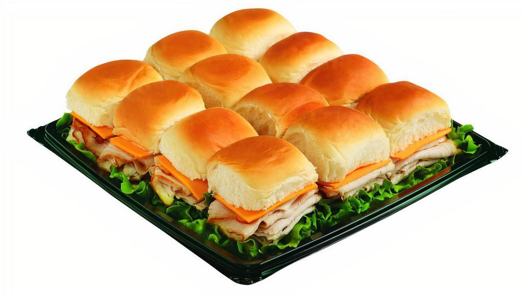 Turkey And Cheddar Sliders · Petite sandwiches made on sweet King's Hawaiian Rolls. Stuffed with our thinly-sliced Turkey and topped with a generous slice of Cheddar Cheese. Serves 8-10.