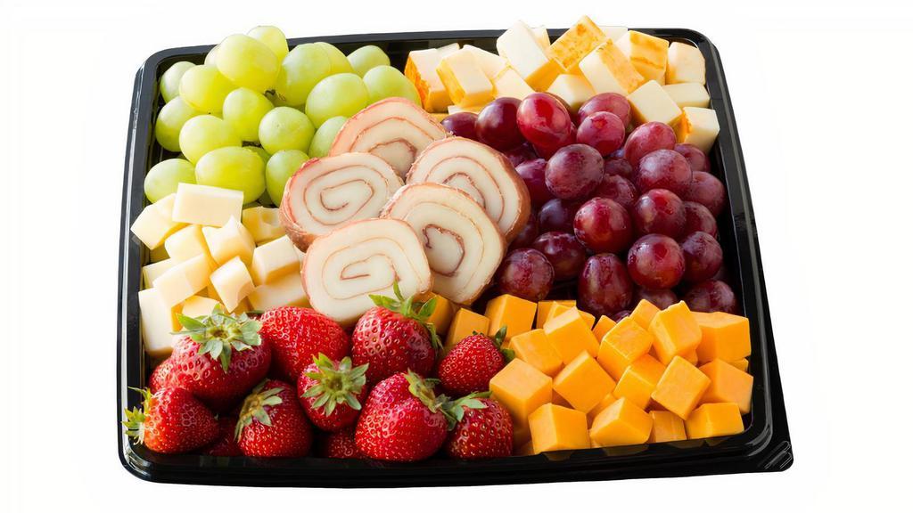 Fruit And Cheese Snack Tray - Small · Includes cubes of Swiss, Muenster and Cheddar cheese refreshingly combined with Grapes and Strawberries. Serves 8-10.