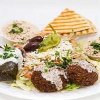Veggie Mezza Plate & Drink · Served on Greek Salad, hummus, baba Ghanoush, pita, dolmas(Grape leaves), Falafel, topped wi...