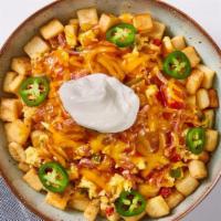 Southwestern Spicy Bowl · Let's spice it up! Seasoned country potatoes, topped with scrambled eggs mixed-in with sauté...