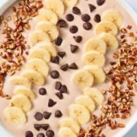 Chocolate Banana Nut Bowl · Sweeten up your day with creamy, chocolate yogurt topped with banana slices, chocolate chips...