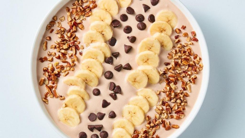 Chocolate Banana Nut Bowl · Sweeten up your day with creamy, chocolate yogurt topped with banana slices, chocolate chips and sprinkled with pecans.